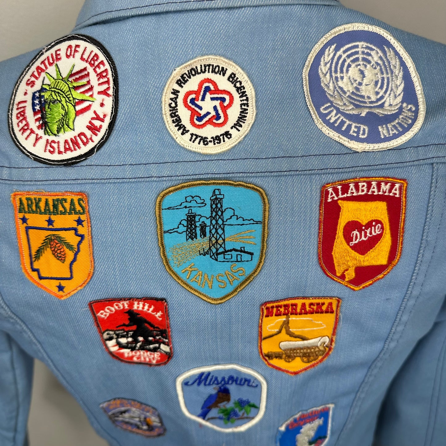 1970s Light Blue Denim Jacket with lots of added Patches, Youth XL/Adult S