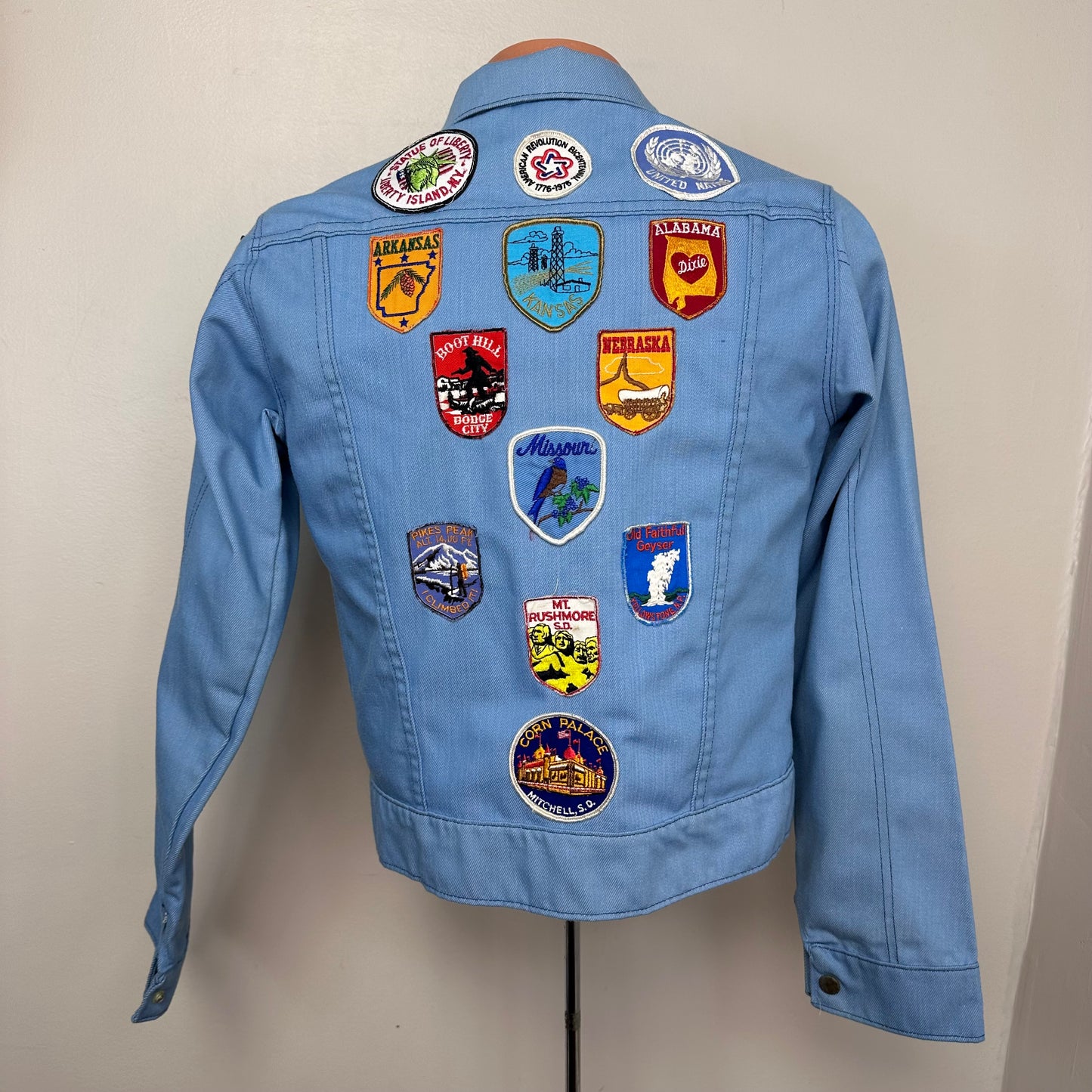 1970s Light Blue Denim Jacket with lots of added Patches, Youth XL/Adult S