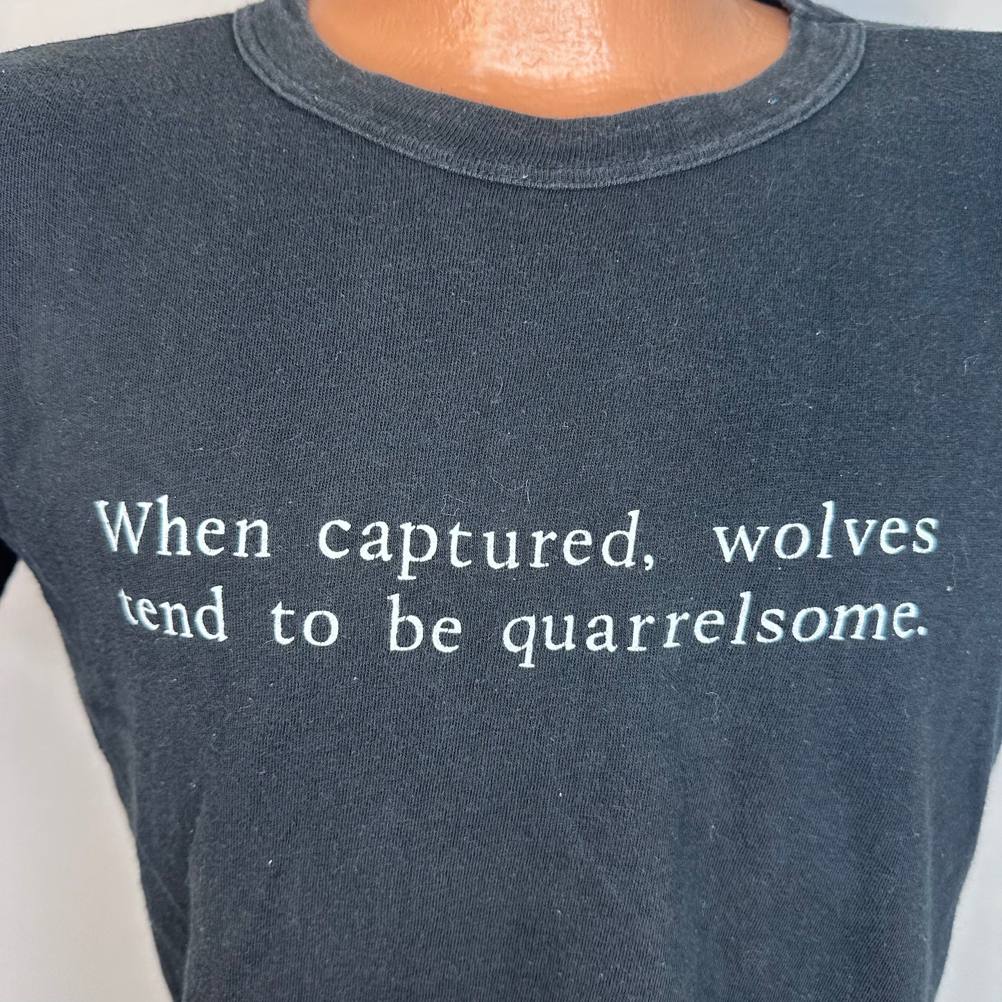 1970s When captured, wolves tend to be quarrelsome Black T-Shirt, Size Medium